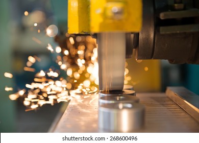 metalworking industry: finishing metal working on horizontal surface grinder machine with flying sparks