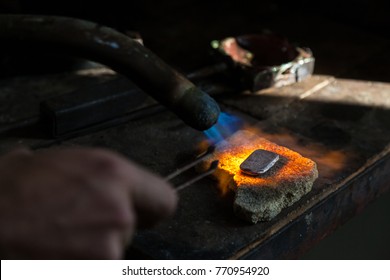 Metalworking with a piece of metal and strong fire. - Powered by Shutterstock