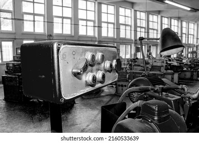 Metalworking workshop, metal processing machines.  Vintage Industrial Machinery in a old factory - black and white photo