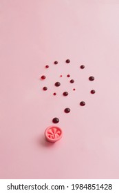 Metaphor of the anus on a pink background. Blood drops, the concept of the cause of rectal bleeding, awareness of hemorrhoids, rectal cancer, proctology. High quality photos.