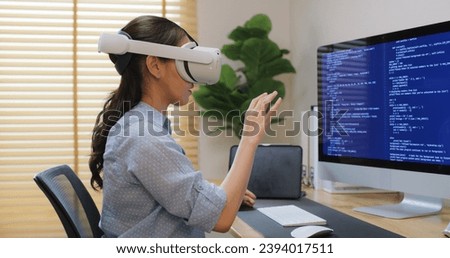 Metaverse app STEM platform developer future skill job workforce for asia people young woman work at home office wear VR headset typing test game on AI IT cyber security cloud computing web solution.