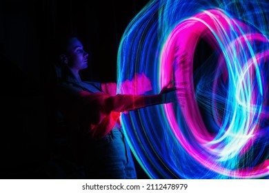 Metaverse digital Avatar, Metaverse Presence, digital technology, cyber world, virtual reality, futuristic lifestyle. Woman in augmented reality, NFT game with neon blur lines - Shutterstock ID 2112478979