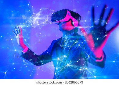 Metaverse digital cyber world technology, man with virtual reality VR goggle playing AR augmented reality game and entertainment, NFT game futuristic lifestyle - Shutterstock ID 2062865573