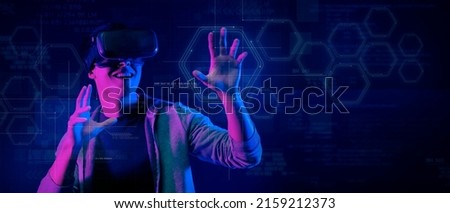 Metaverse digital cyber world technology, man with virtual reality VR goggle playing MR mixed reality game and entertainment, future abstract game futuristic lifestyle