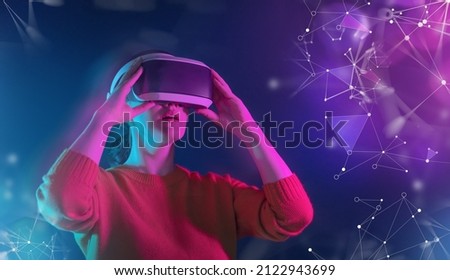 Metaverse technology concept. Woman with VR virtual reality goggles. Futuristic lifestyle. 商業照片 © 