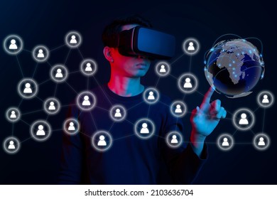 Metaverse virtual reality, augmented reality technology world connection. Man using virtual reality glasses touch world map. - Powered by Shutterstock - Get 15% off with code: PIKWIZARD15