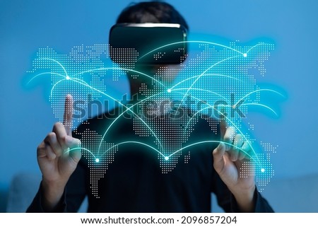Metaverse virtual reality, augmented reality technology world connection. Man using VR glasses touch map.