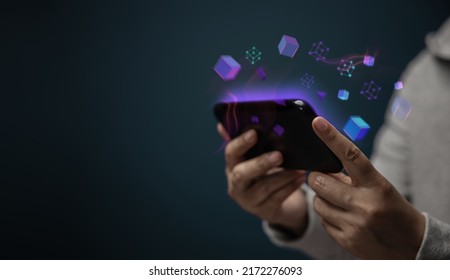 Metaverse, Web3 and Blockchain Technology Concepts. Closeup of Hand Using Smartphone for Connect a Community or Playing NFT Virtual Game - Shutterstock ID 2172276093