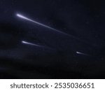 Meteor trails against the background of stars. Fireballs in the night sky. Shooting stars isolated on a dark background.