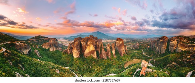 Meteora, Greece. Sandstone rock formations, the Rousanou and Nikolaos monasteries at sunset. Travel destination background. Panoramic view. - Shutterstock ID 2187837687