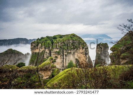 Meteora rocks appear through the clouds, Thessaly, Greece