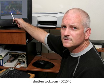 A Meteorologist Pointing Out A Hurricane Developing