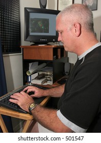 A Meteorologist Tracking A Hurricane On His Computer