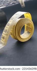 The meter is the basic capital of tailors, because it is used to measure the size of the customer's body parts, as well as to measure the fabric to be cut - Shutterstock ID 2314363985