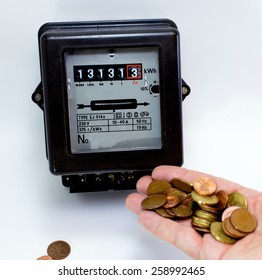 meter and the hand full of European currencies