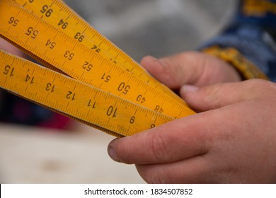 Meter Stick In A Child's Hand