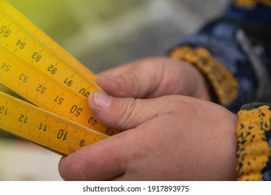 Meter Stick In A Child's Hand