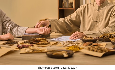 The method of taking a patient's pulse involves extending and placing their hand on a wooden board wrapped in cloth. The template photo shows a traditional medicine clinic with many plants on display.