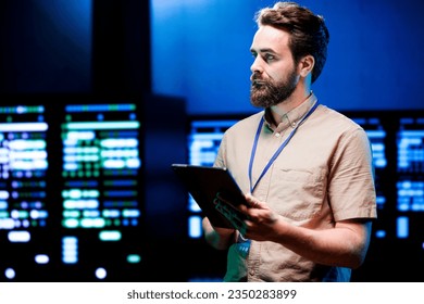 Meticulous computer scientist monitoring server racks, optimizing them for data processing requirements of AI workloads. Manager overseeing neural network data center used for machine learning