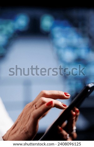 Meticulous wireman using tablet to make sure data remains shielded from security hurdles, safeguarding cloud computing company servers against unauthorized access, close up