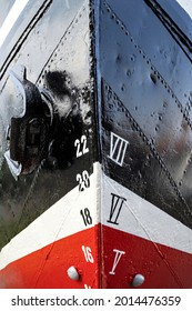 Metric And Imperial Draft Marks On The Bow Of An Old Ship With Reveted Hull