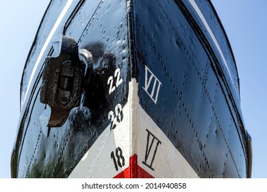 Metric And Imperial Draft Marks On The Bow Of An Old Ship With Reveted Hull