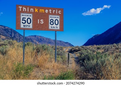 Metric To Imperial Measurement Speed Limit Sign From Miles Per Hour To Kilometers Per Hour At The Nighthawk Border Crossing In British Columbia, Canada.