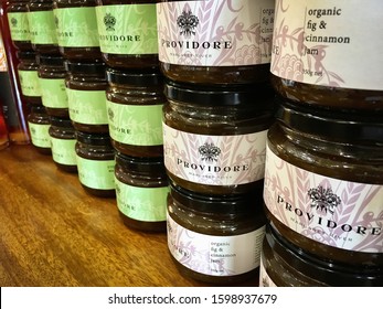 Metricup, WA / Australia - December 21, 2019: Providore Jars Of Jam Stacked Neatly On A Wooden Table In Margaret River Providore Food And Wine