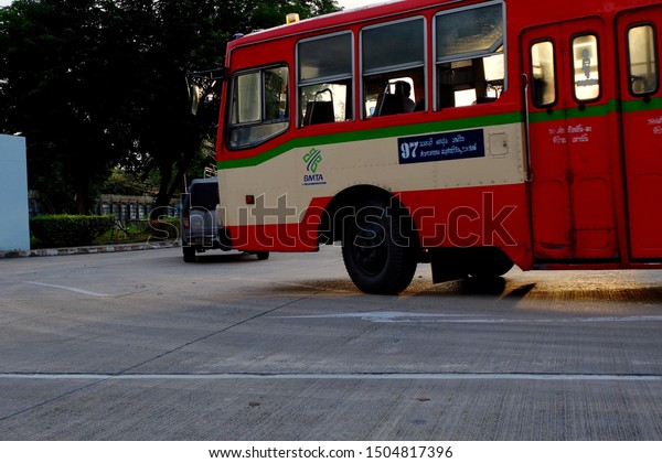 Metro city red bus in Thailand Asia August 15 2019\
evening the driver was driving and turning fast hurry up to take\
passengers at next stop 