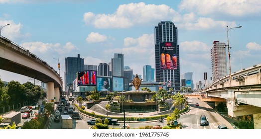 Metro Manila, Philippines - April 2021: Panorama Of EDSA Shrine, Robinsons Galleria Complex And Ortigas Center CBD.