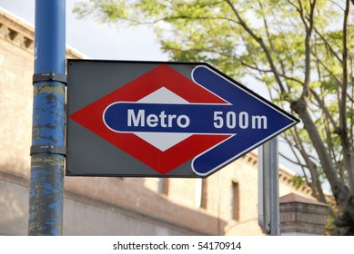 Metro sign in Madrid, Spain. Subway is near. 500 m