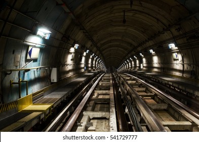 Metro Subway Of Turin (Italy), Dark Tunnel With Rails Seen From The Train