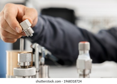 The Metrology And Standardization Laboratory Specialist Connects The Device Under Test Pressure Gauge To The Pressure Calibration And Verification Instrument. Checking International Quality Standards