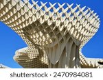 Metropol Parasol, popularly known as Setas de Sevilla, is a pergola-shaped structure made of wood and concrete located in Sevilla, Spain