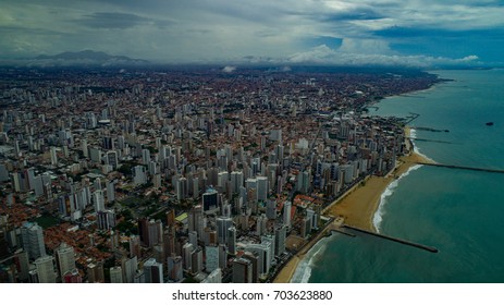 Metropolis aerial view of Fortaleza, Brazil, one massive city aerial perspective - Shutterstock ID 703623880
