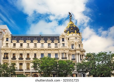 Metropolis Building In Madrid Under A Cloudy Sky