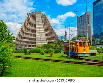 Metropolitan Cathedral Of Saint Sebastian And Old Yellow Santa Teresa Tram (Bonde De Santa Teresa) Is A Historic Tram Line In Rio De Janeiro, Brazil.