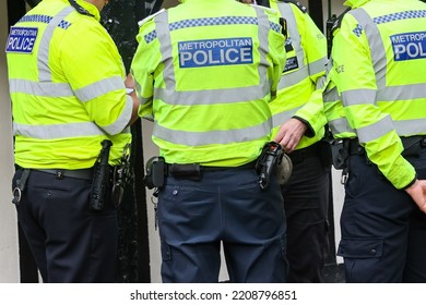 Metropolitan fully equipped Police officer back of the vest in London, UK - Shutterstock ID 2208796851