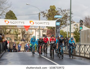 Meudon, France - March 4, 2018: The Belgian Cyclist Thomas De Gendt Of Team Lotto-Soudal Riding In A Group Of Cyclists During Stage 1 Of Paris-Nice 2018.