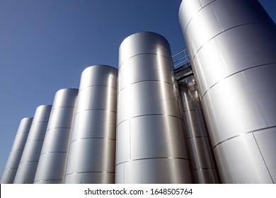 MEUZAC, FRANCE - 17 september 2019 - Modern industrial silo storage tanks for oil, outdoors on a sunny day.