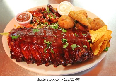 Ribs back baby barbecue Tex Mex BBQ Ribs And Wings Platter With Nachos Tortilla Stock Photo, Stock, Photograph, Image, Picture 