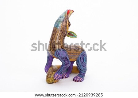 Mexican Alebrije, a colorful and beautiful craft handmade. Animal wood sculpture and painted by hand with georgeos figures and patterns. 
