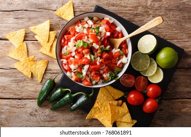 Mexican Appetizer Pico De Gallo Close-up In A Bowl On The Table. Horizontal Top View From Above
