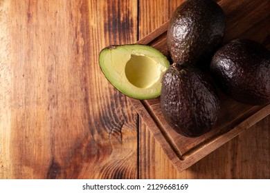 Mexican Avocado (persea Americana) On Rustic Wooden Table. Main Ingredient To Prepare Guacamole. Top View Image