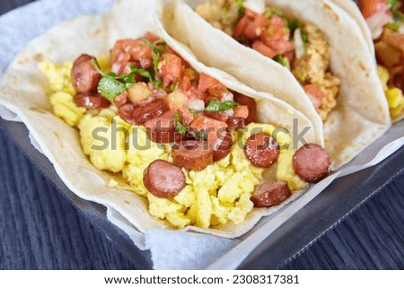 Mexican breakfast three tacos sausage chorizo bacon egg tomato chives flour tortillas