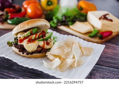 Mexican Burger With Chips And Avocado On Table Food With Ingredients In Mexico
