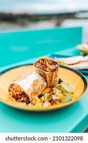 Mexican Burrito on plate with view outside