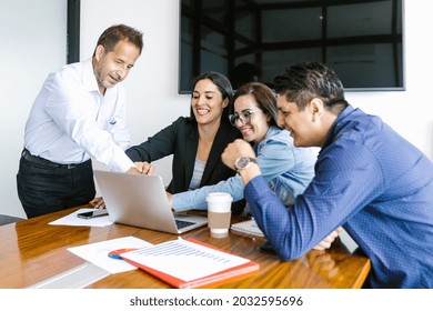 Mexican Business People In Modern Office Analyzing Graphs Using Computer In Mexico City