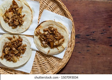 Mexican carnitas tacos, slow cooked pulled pork, traditionally from the state of Michoacán and made famous by the towns of Quiroga and Uruapan. Served with onion, salsa banderita and spicy chili sauce