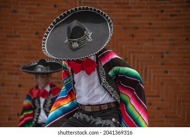 Mexican charro dancer with sombrero and multicolored serape from jalisco mexico with mariachi music